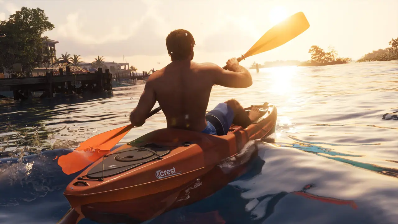 A paddler in an orange Crest kayak on calm water at sunset