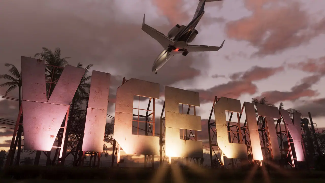 A giant Vice City sign lit up at dusk with a private jet flying low overhead